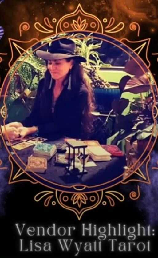 Tarot reader seated at a table with cards and decorative background.